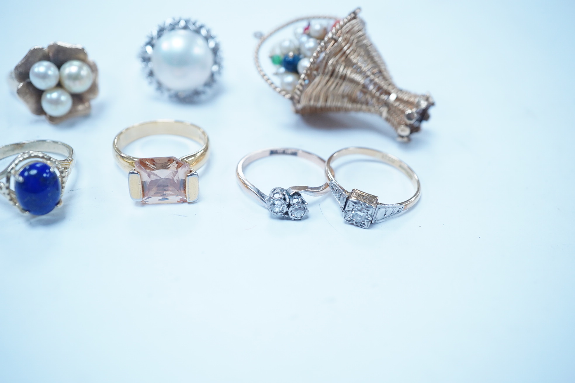 A modern 14k and three stone cultured pearl set cluster ring, size M, an 18ct, plat and two stone illusion set diamond crossover ring, an Italian 750 white metal and mabe pearl set ring, a 14k, cultured pearl and cabocho